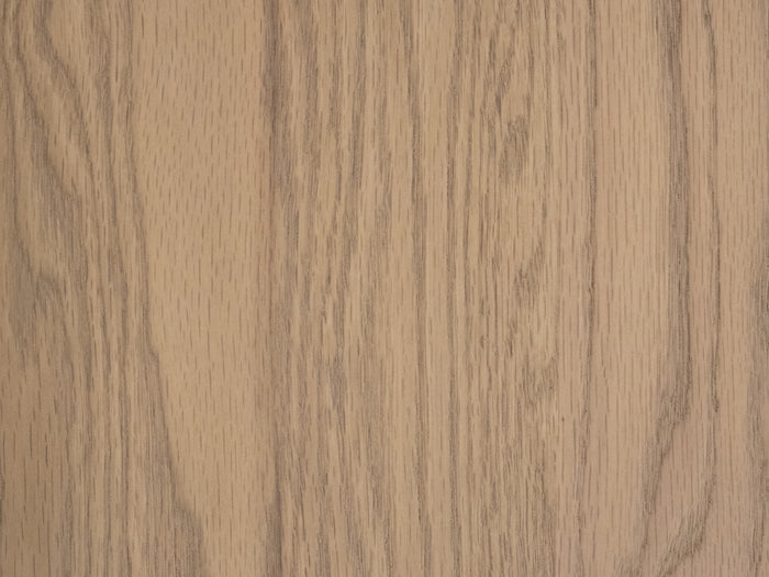 Close-up view of the Oat on Oak Sample by James+James, featuring a light brown wood surface with visible natural grain patterns, vertical lines, and a subtle oak finish for an organic, textured appearance.