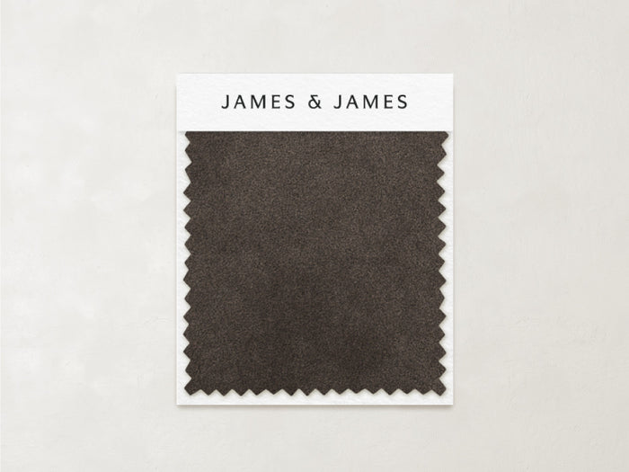 A dark brown rectangular "Mink - Mohair Swatch" with zigzag edges shows its natural texture, attached to a card labeled "James+James" at the top, set against a light background.