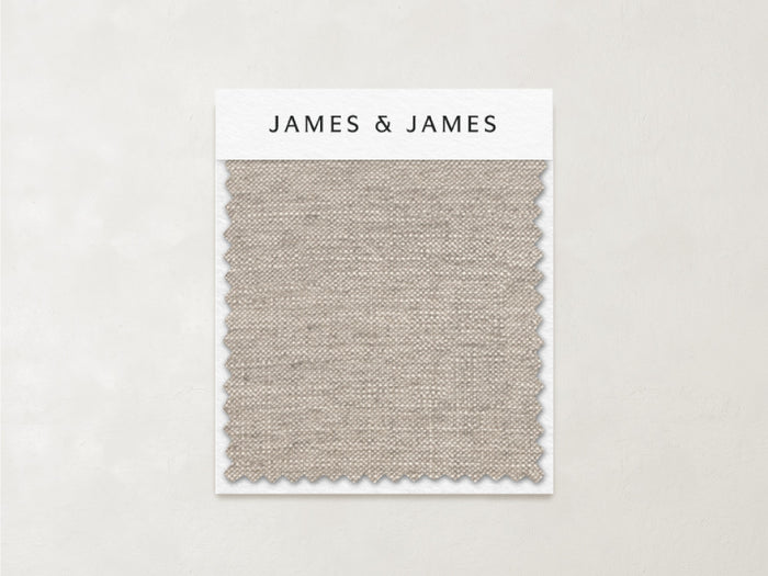 A rectangular swatch of light beige, breathable linen labeled "James+James" and named "Natural - Linen Swatch" is displayed on a card against a plain, neutral background.