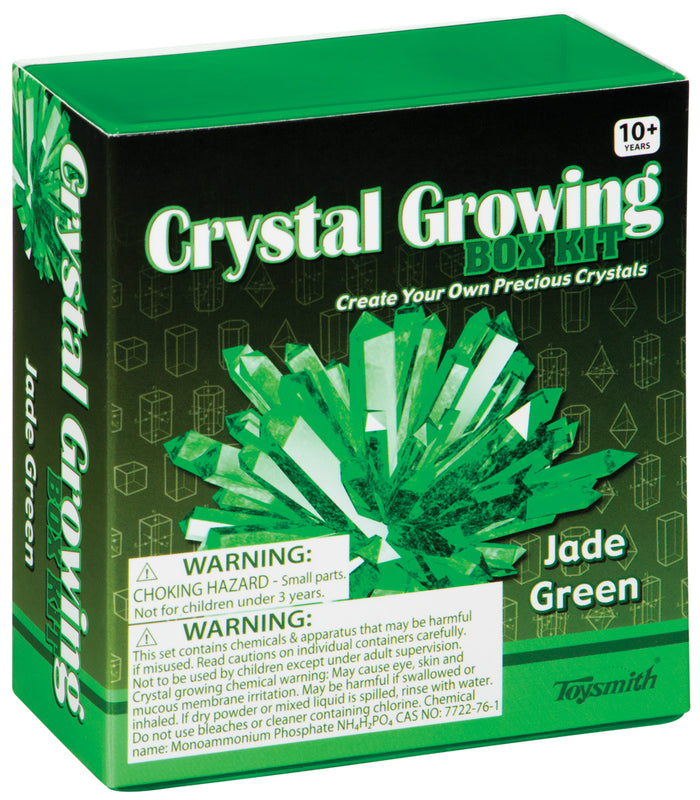 The Toysmith Crystal Growing Kit comes in a green and black box for ages 10+, featuring an illustration of green crystals, safety warnings, and is ideal as a DIY science kit or kids experiment.