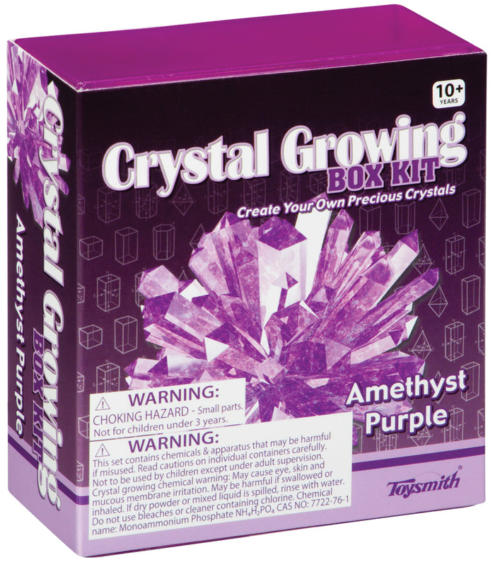 A purple Toysmith Crystal Growing Kit box for ages 10+, featuring illustrated amethyst crystals. This DIY science kit includes choking hazard and chemical warnings. Brand: Toysmith.